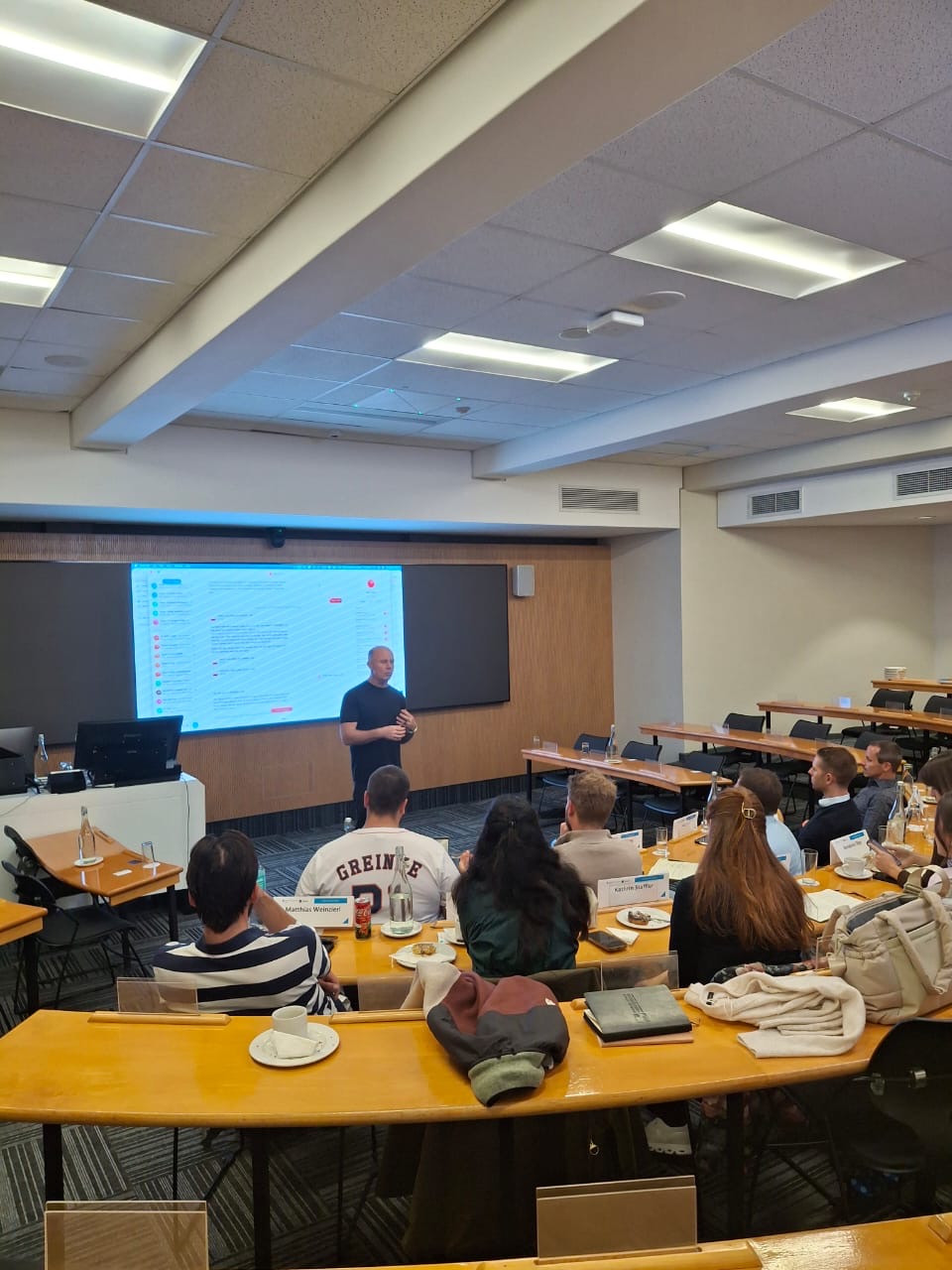 A lecturer leading a discussion with a group of students